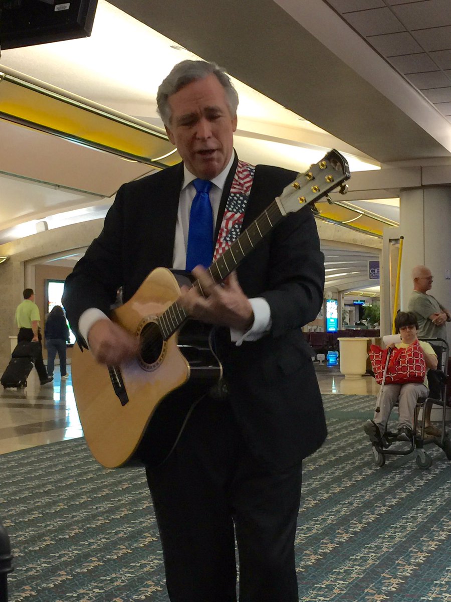 BushGuy's tweet photo. The flight crew asked for a song at Orlando international airport this morning. How could I say no? #BushGuy https://t.co/Pjlzes9E4Z