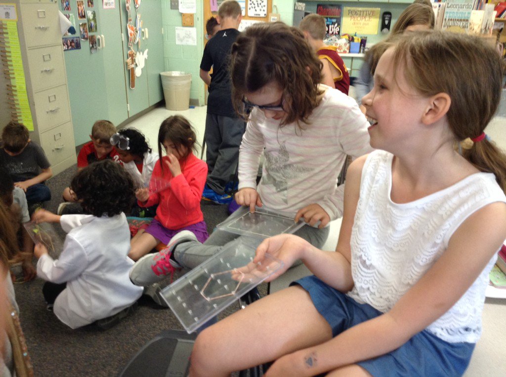 Practicing making plane shapes. Fun with geo boards! @AltonDarby