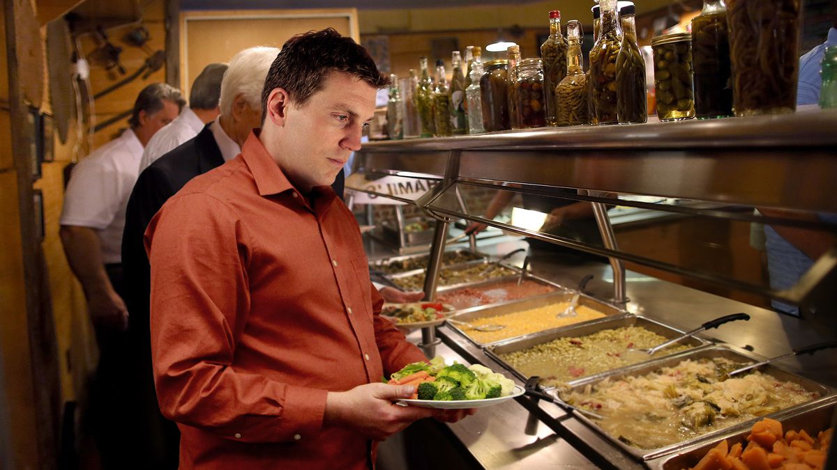 Man Kicking Self For Wasting Valuable Plate Space At Beginning Of Buffet Line onion.com/279mC3w