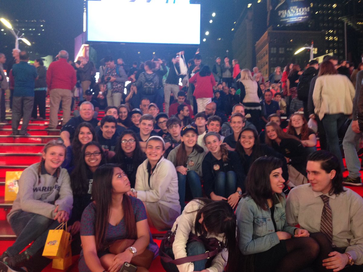 FBAMiddleSchool's tweet photo. Sitting on the red stairs in Times Square! These kids are having a blast!!! And the sponsors too... :) https://t.co/r2Gj6RYY9z