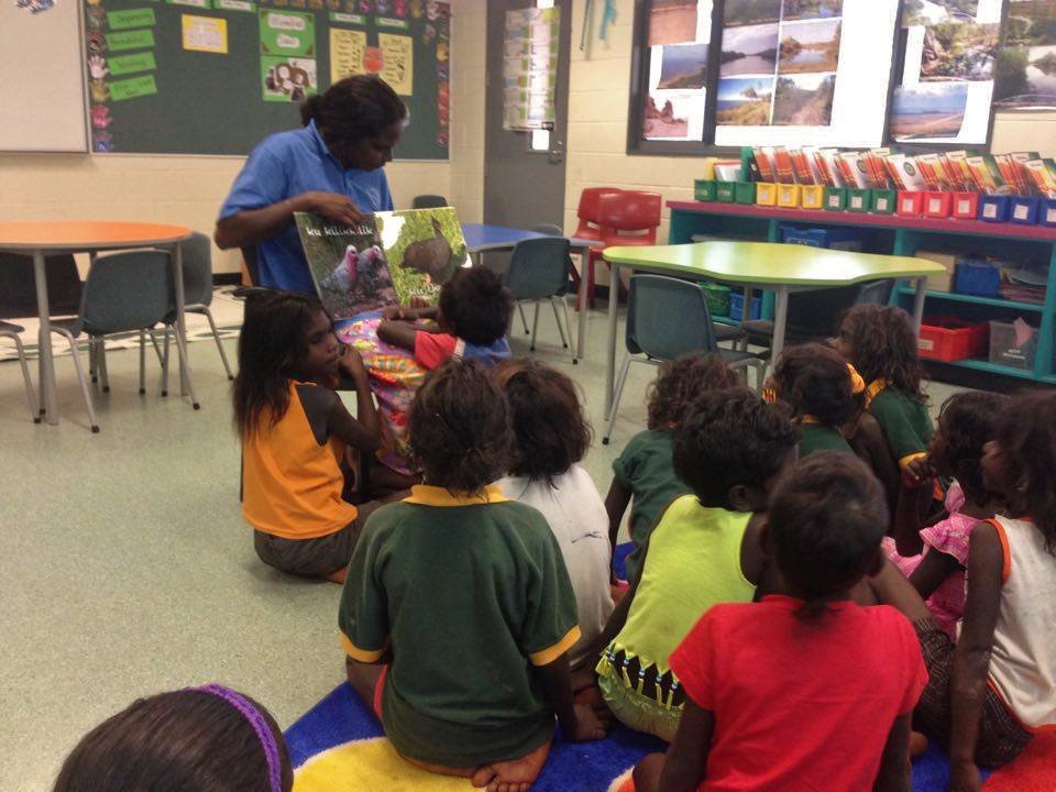 OLSHTCC's tweet image. Our Year One @OLSHTCC students love reading language books with their Assistant Teacher. #Wadeye #NT #Australia