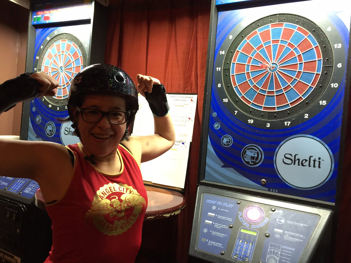 AngelCityDerby's tweet image. Did you know that Bantam Menace is also a darts pro? Come watch her in action without the sharp pointy things. 5/14!