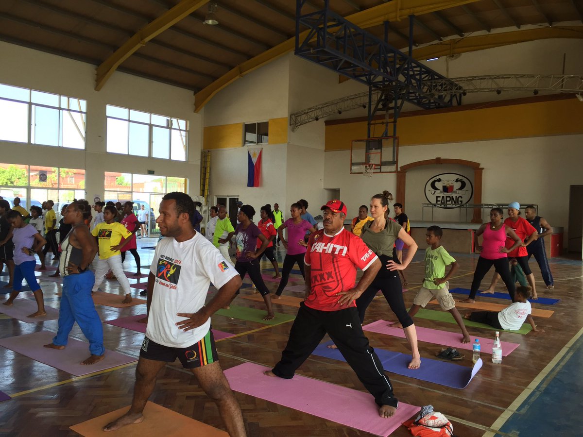 fazbazari's tweet photo. Governor of NCD PowesParkop with @UN_Women Vilupti doing yoga at the Yoga Unites community yoga class! https://t.co/HUwrxra2lX