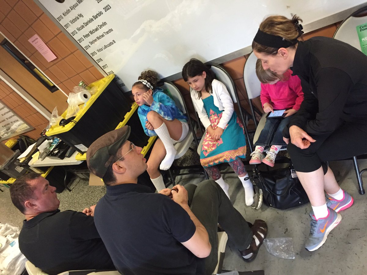 Pat Fay busy fitting dancers!