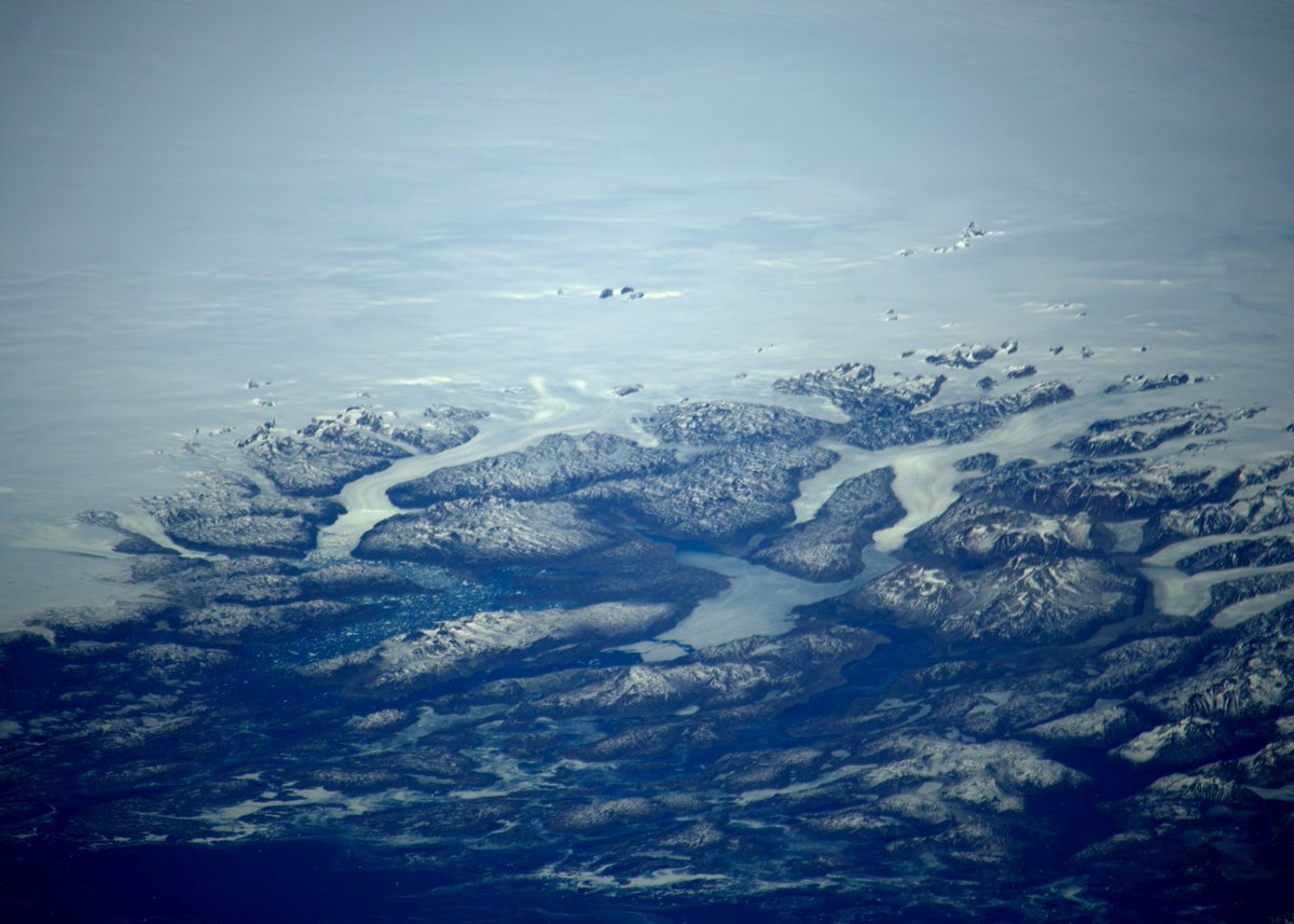 astro_timpeake's tweet photo. This is as far north as my lens will stretch – #Greenland’s southern coast https://t.co/wt6xj4zKXr https://t.co/leQt4HK15Y