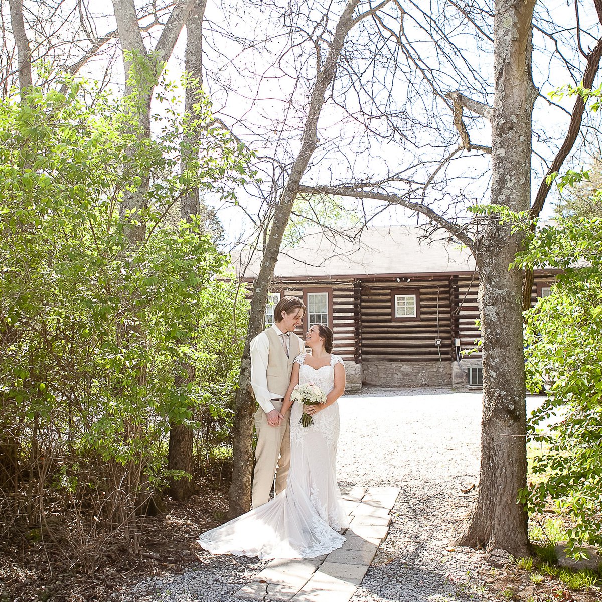The bride's champagne lace #WeddingDress with the #groom's tan suit were perfect for a #SpringWedding <a href="/LovelessCafe/">Loveless Cafe</a>