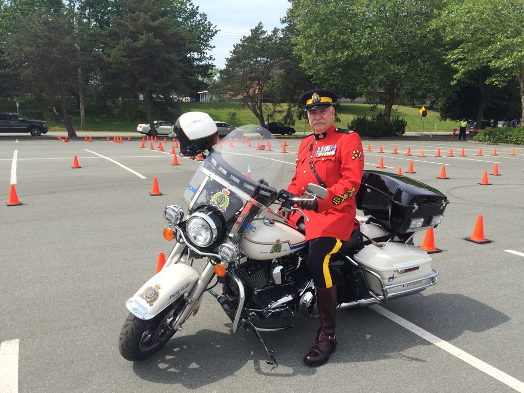 BurnabyRCMP's tweet photo. SSM John Buis finally gets on an RCMP m/c at the Bby m/c Safety Skills Challenge. No riding though, no C6! #bcrcmp. https://t.co/1849TnaYcg