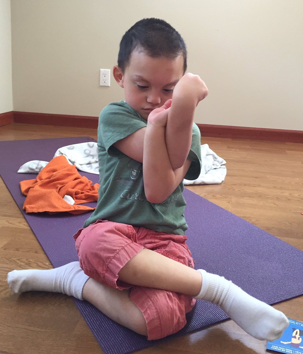 This little guy loves yoga!