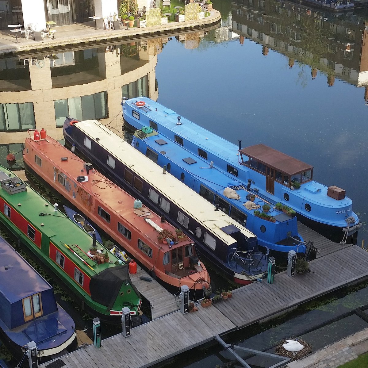 vonStrunckel's tweet photo. The canal: the light's glorious and the water meditatively still. Also, spot #MrsSwan snoozing away in her nest. https://t.co/PfoJb8B5x6
