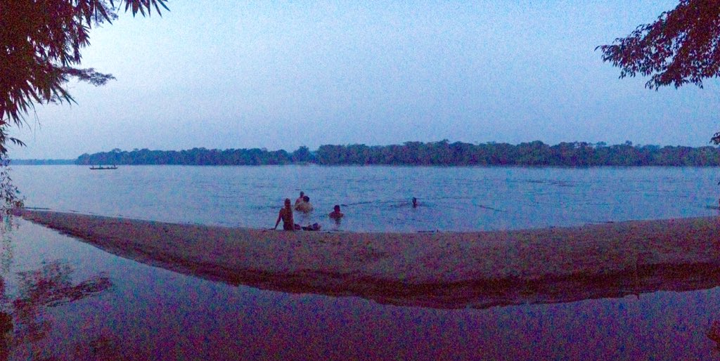 Sunset dip in the mighty Kwilu River, Vanga, DRCongo, at the end of a sweltering day at the hospital. <a href="/oceanswims/">oceanswims.com</a>