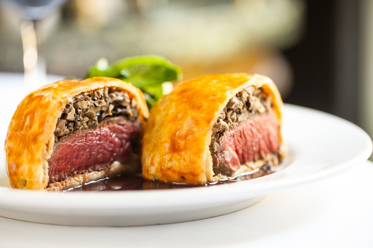 Beef tenderloin wrapped in crêpe topped w/mushrooms then wrapped in pastry dough =tonight's special,Beef Wellington!