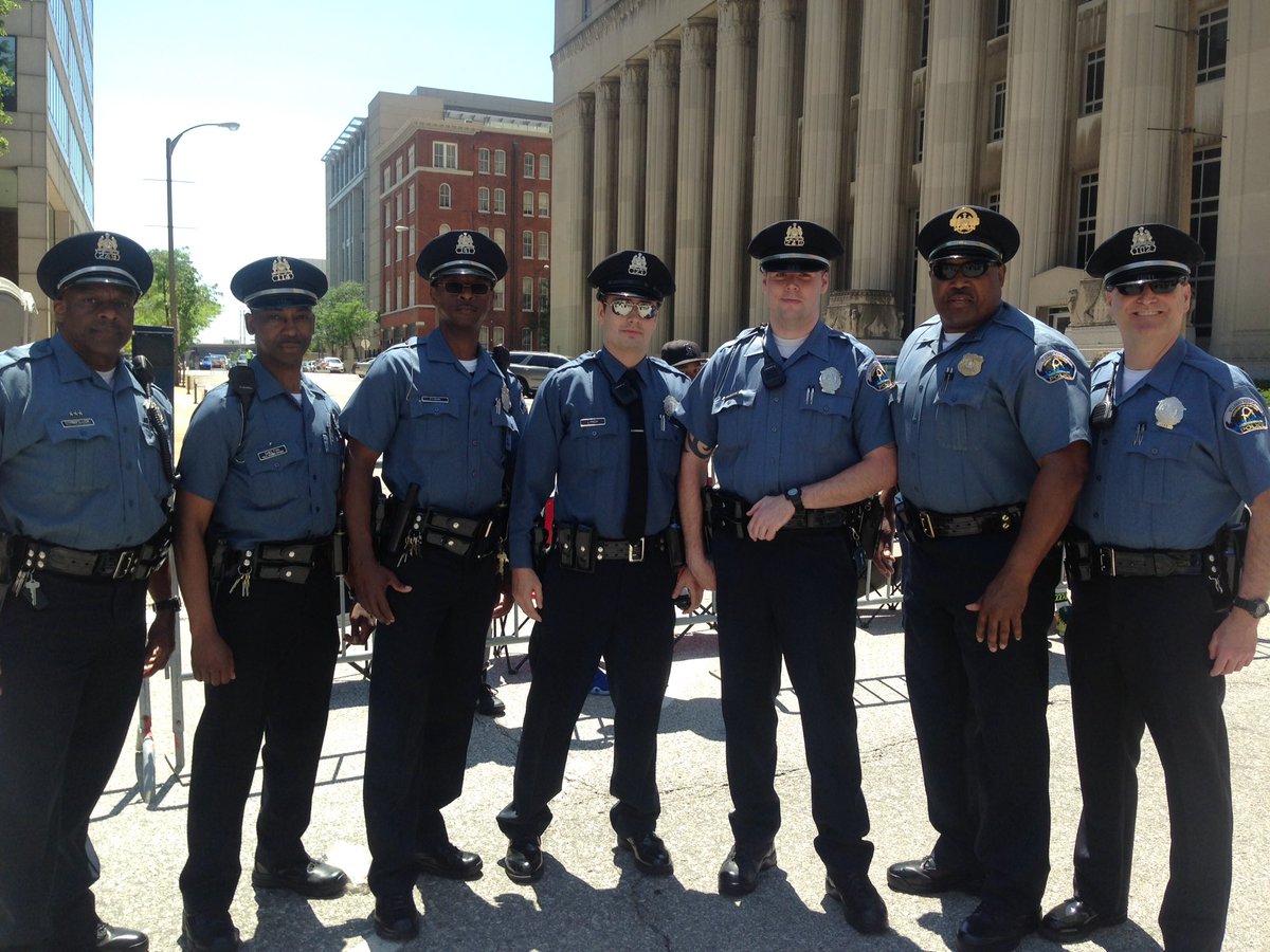 SLMPD's tweet photo. Our brothers from the Airport Police Division walked with us in the #AnnieMaloneParade. #AGreatSTLTradition https://t.co/B3bwV2Jtm7