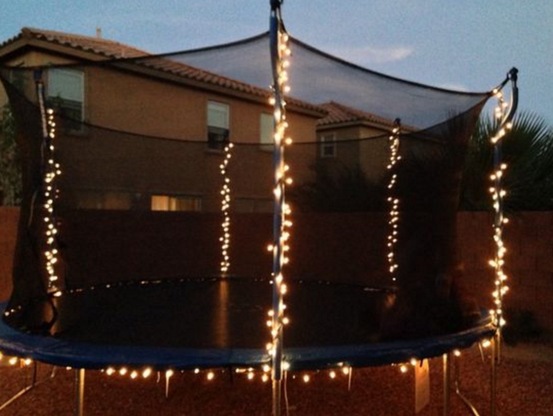 SCBackyards's tweet image. For some fun Summer nights, attach Christmas lights to the #trampoline with zip ties! #OutdoorTip #play #summertime