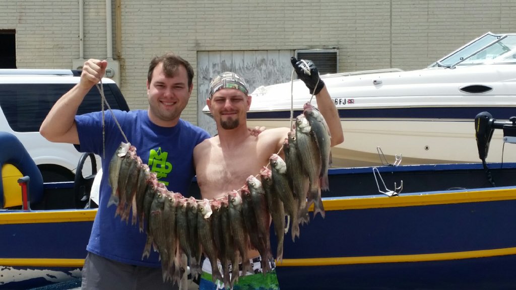 My bro and I with a nice stringer of sandbass what a day of fighting fish!!!