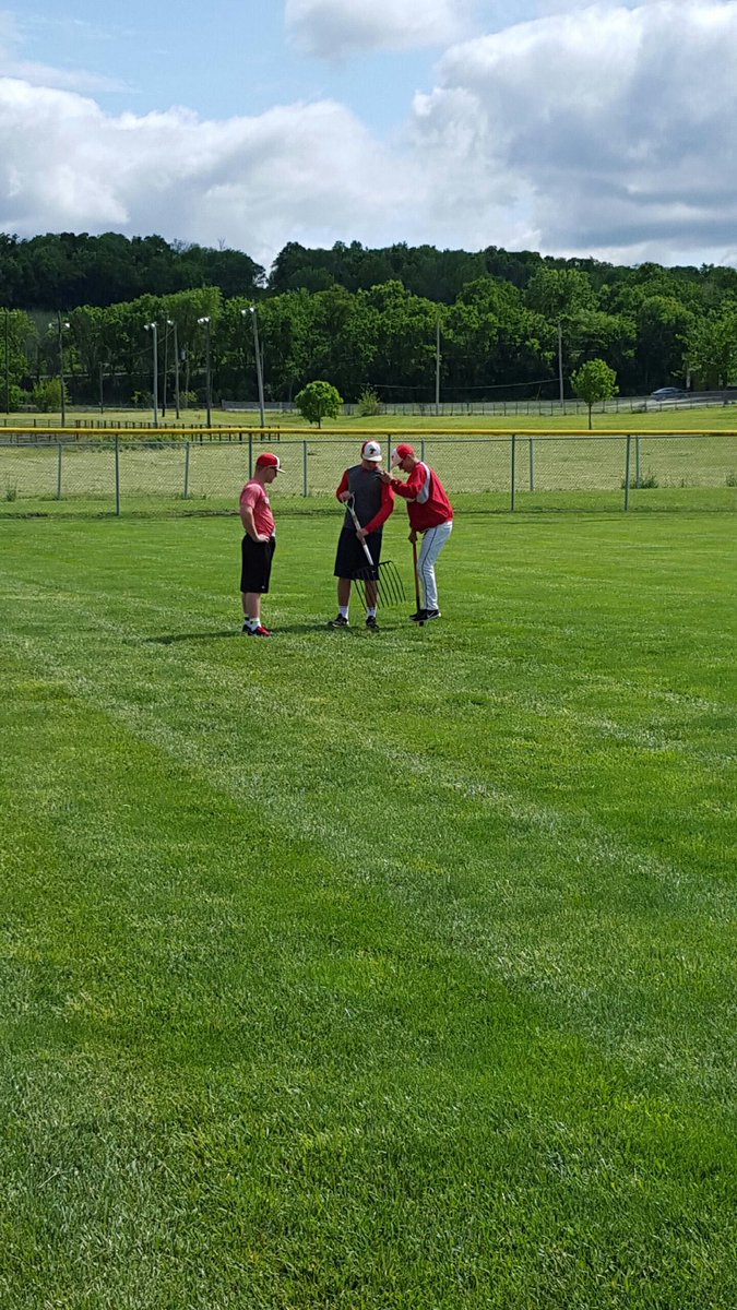 The boys getting the field ready to be played on Thursday @ 5pm against Bishop Miege ⚾️