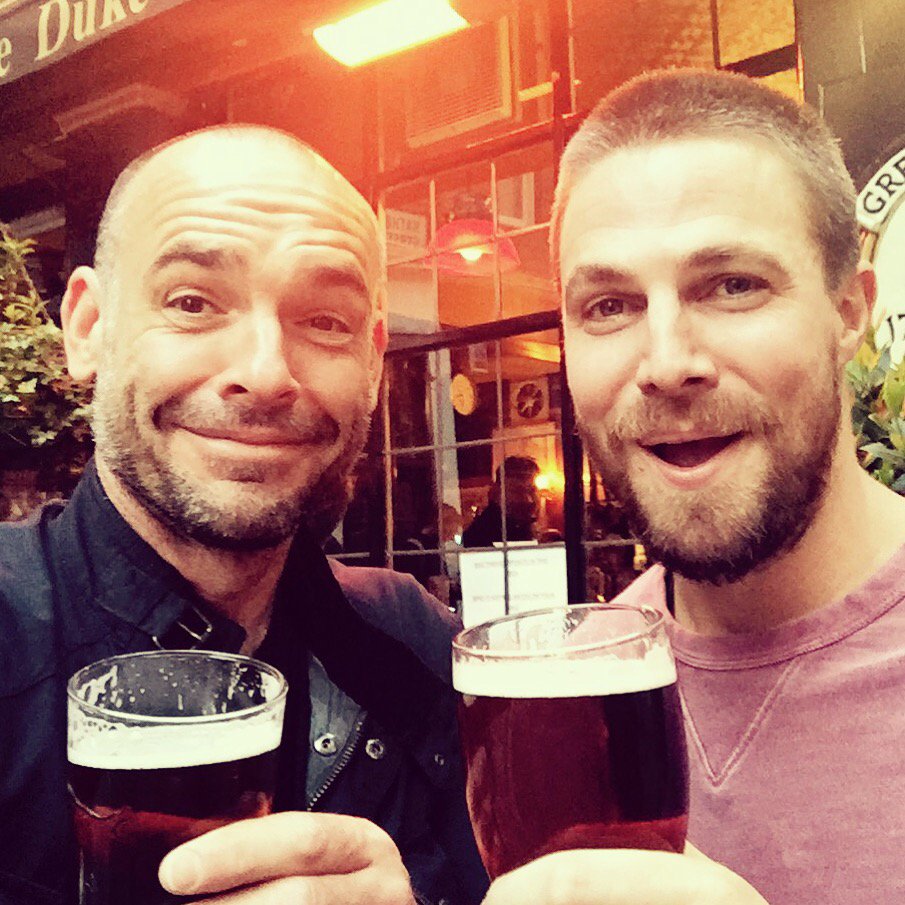 PaulBlackthorne's tweet photo. London pint pit stop with the big man @StephenAmell 
Proper beer! 
Vietnam tomorrow.
#SaveTheRhinoVietnam https://t.co/4zwhD6aVo0