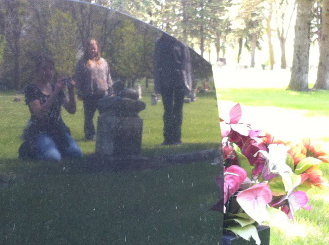 schutt_beth's tweet photo. #WMSedchat  Kids practicing taking photos with a reflection off of something. Nice, shiny, black cemetery monuments. https://t.co/0QMnZi3mws