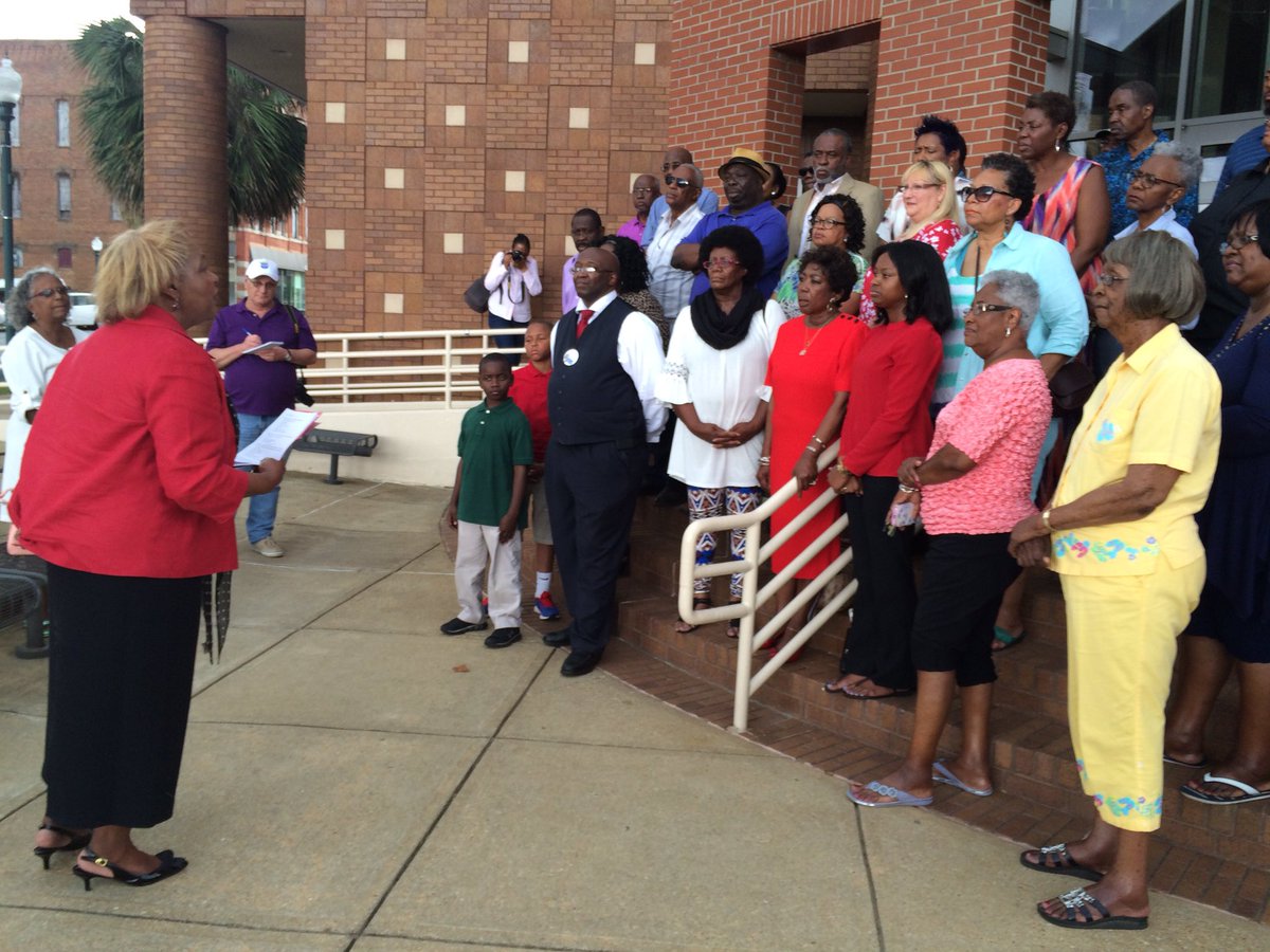Geraldine Hudley holds her press conference with supporters after Ealum criticized her work.