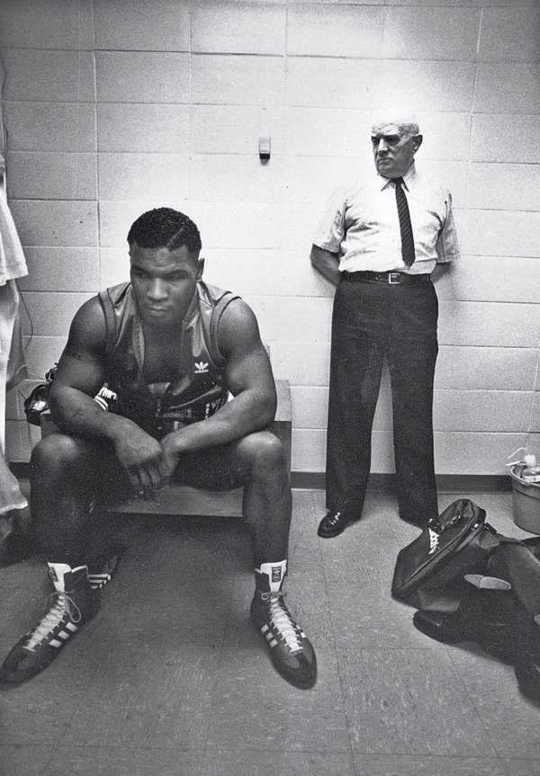 ThatsHistory's tweet photo. Mike Tyson, and his trainer Cus D'Amato, before his first professional fight, 1985 https://t.co/PGQW4I4Jni