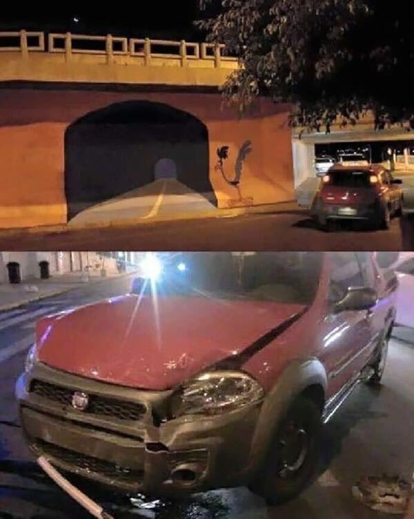 WORLDSTAR's tweet photo. A graffiti artist put a road runner tunnel on a wall. And someone tried to drive through it... https://t.co/ui52E6udpL