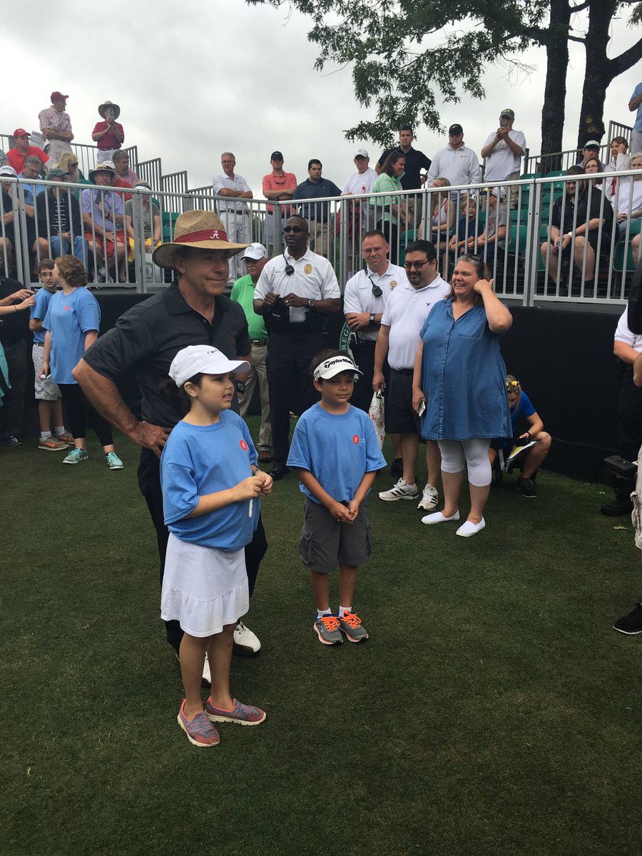AlabamaFTBL's tweet photo. Coach Saban on the 1st tee at the Regions Tradition at Greystone with kids from Children's of Alabama. #RollTide https://t.co/jgKWCP0Njb