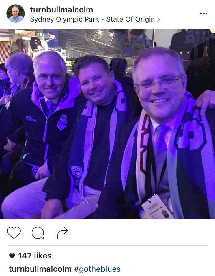 euanblack's tweet photo. Is @ScottMorrisonMP wearing a 'bit of both' scarf?! The ultimate crime! #origin #stateoforigin #VBBlues https://t.co/qscL9bxcdY