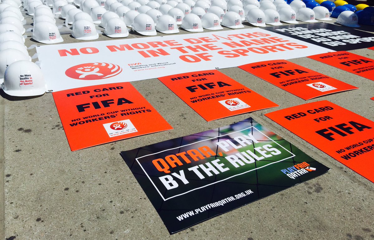 PlayfairQatar's tweet image. Joining in @BWIglobal protest outside the #UN - hundreds of construction helmets representing deaths on #qatar2022