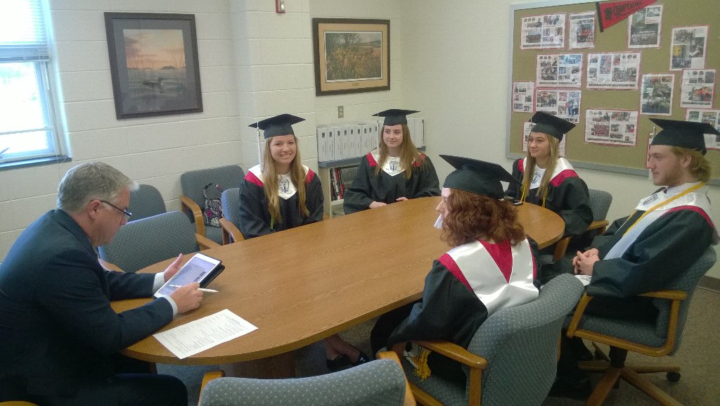 Superintendent Scott Smith speaking with some if our graduates.