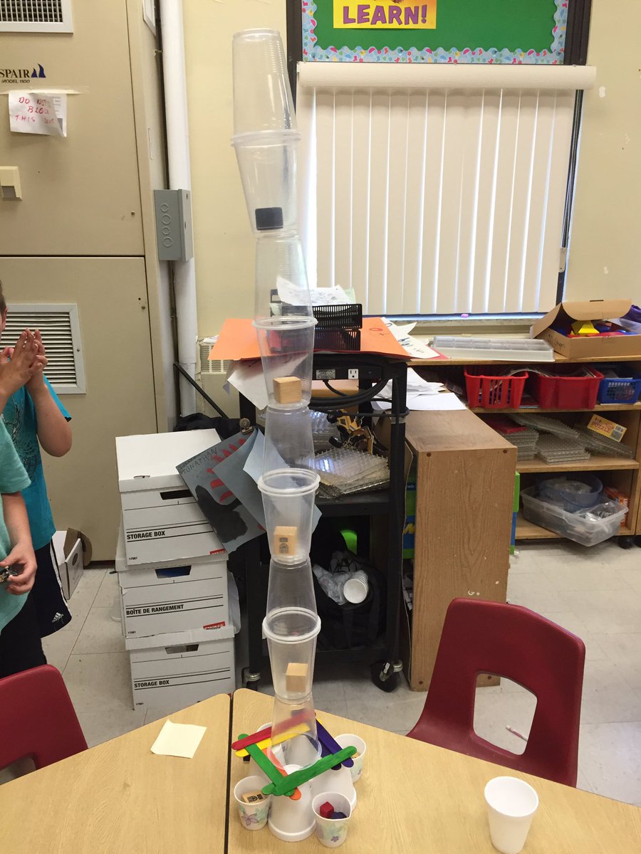 Why did the students put blocks in the cups?
