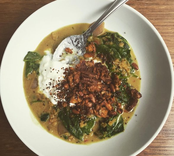 Left over #Dahl turned into a soupy #lunch with coconut milk, spinach and savoury pecan and walnut #granola
