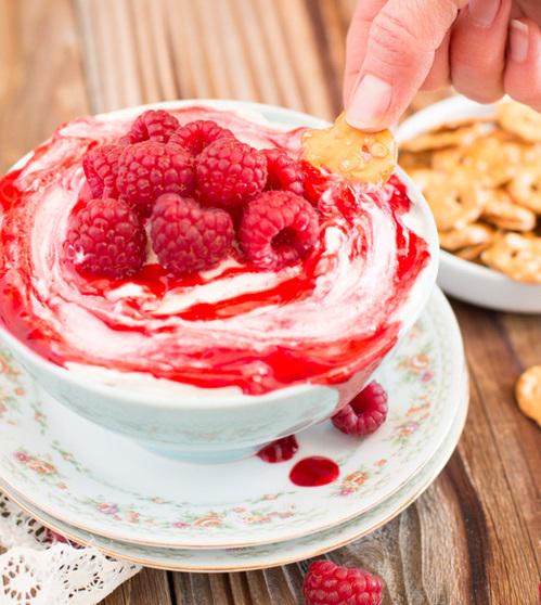 Cheesecake dip with raspberry sauce.