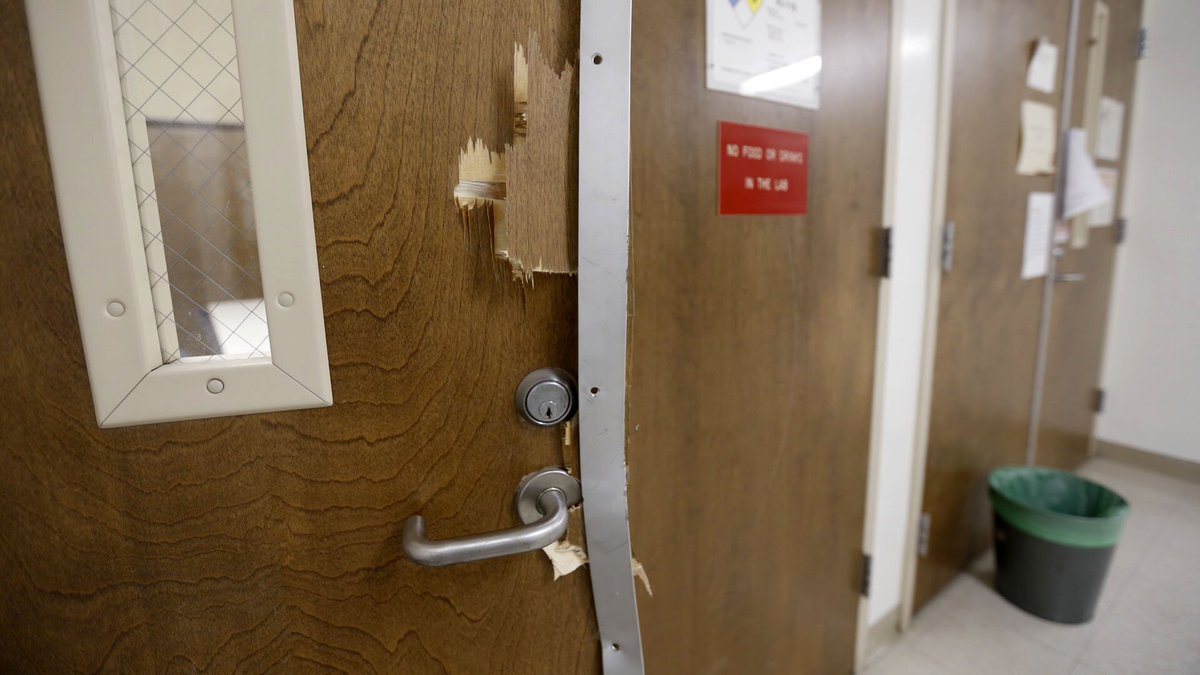 Smashed doors are seen in the UCLA engineering building near where a professor was shot and killed Wednesday. (Al Seib / Los Angeles Times)