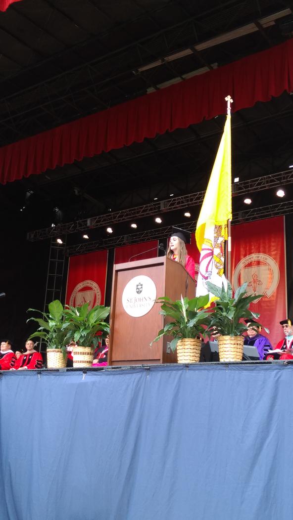 StJohnsU's tweet photo. "I implore you to not just be present, but to be powerful." -Student Speaker April Gardner https://t.co/X7KMOTKxK4
