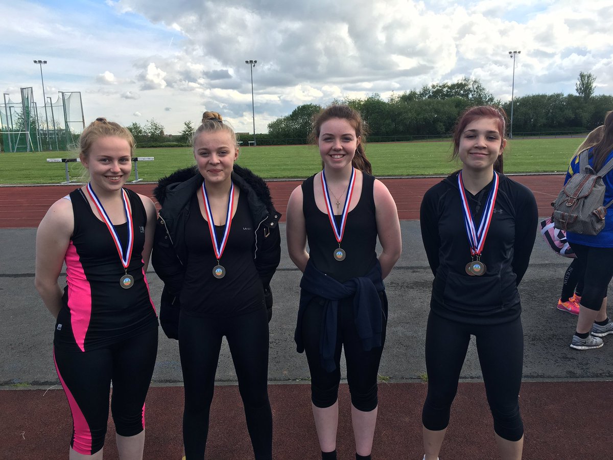 Senior girls team proudly showing their silver medals for the 4x100m relay. #whatwedo