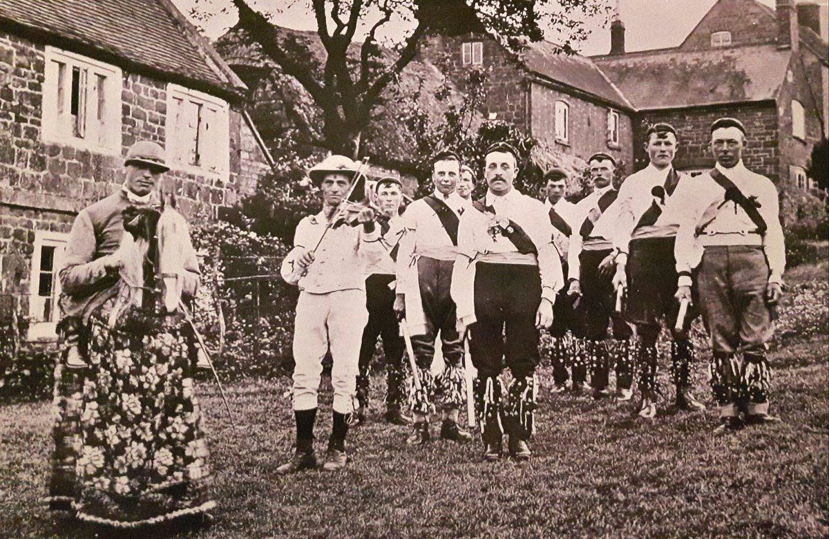 Here's a photo of Ilmington Morris in days gone by, including widely known fiddler Sam Bennett
