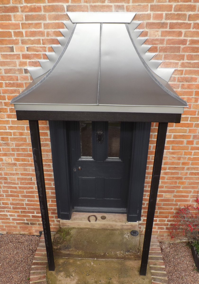 Porch Roof, Mansfield. A curved zinc roof was added to an existing porch roof to transform the front of the property