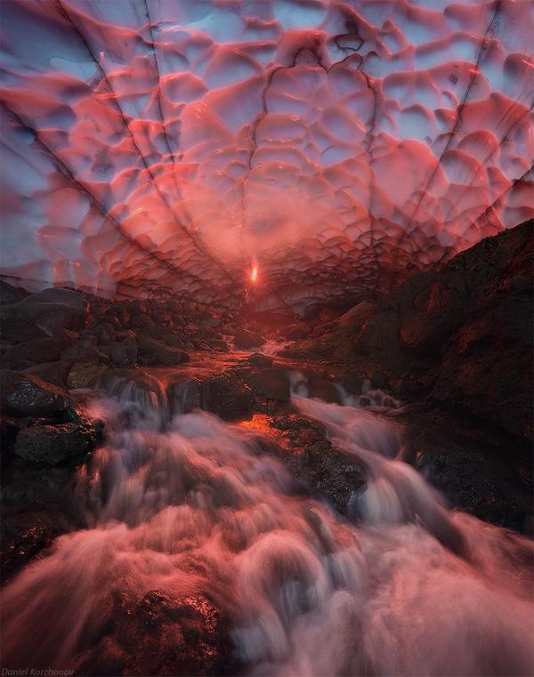 Huge ice cave under Mutnovskiy Volcano lit by falsefire, Russia.
