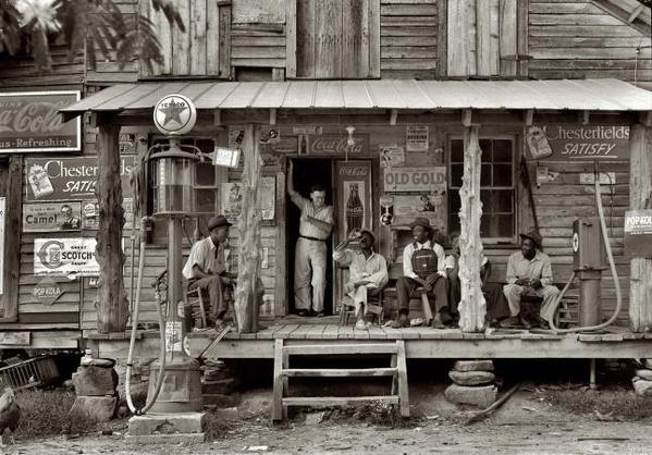 Cracker Barrel, July 1939. Gordonton, N.C. "Country store on dirt road. Sunday afternoon."