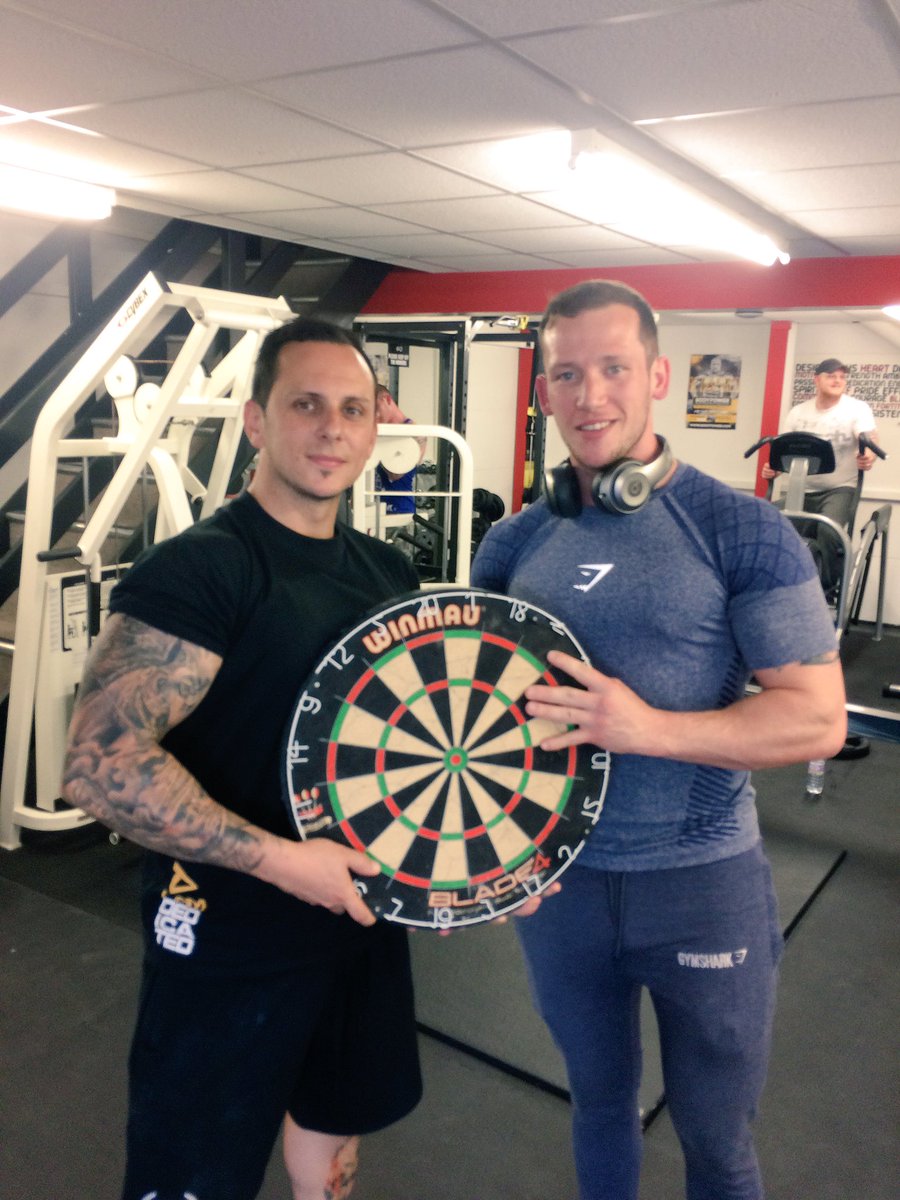Our sponsored athlete <a href="/MadMonk180/">Arron Monk</a> with his dart board for the gym. Darts between sets on arm day #fevohq #gym