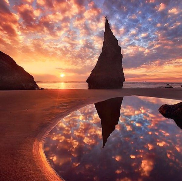 travelsuncorked's tweet photo. Reflection of Wizards Hat in Oregon #Oregon #wizardshat #idealdestinations #travel #coast #rock #sunset #reflection https://t.co/vC3WPQMLPn