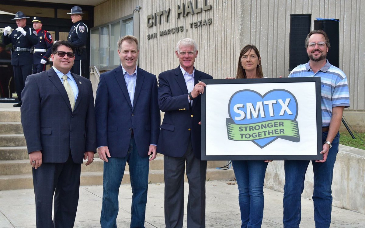 CityofSanMarcos's tweet photo. #SMTX held a flag raising ceremony today as a celebration of community strength on the anniversary of the #SMTXFlood https://t.co/8P27gJG8rB