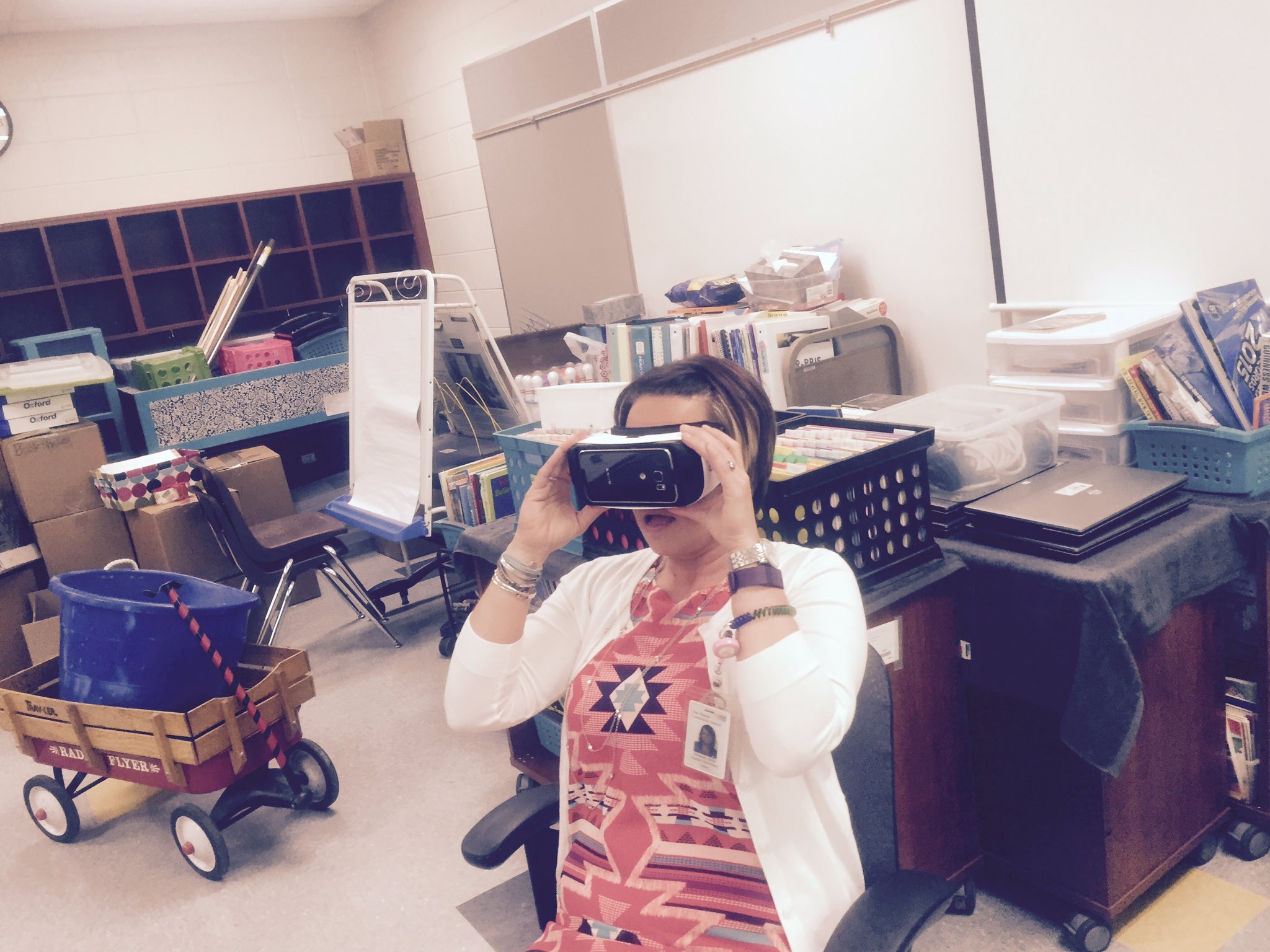 Teacher using VR helmet