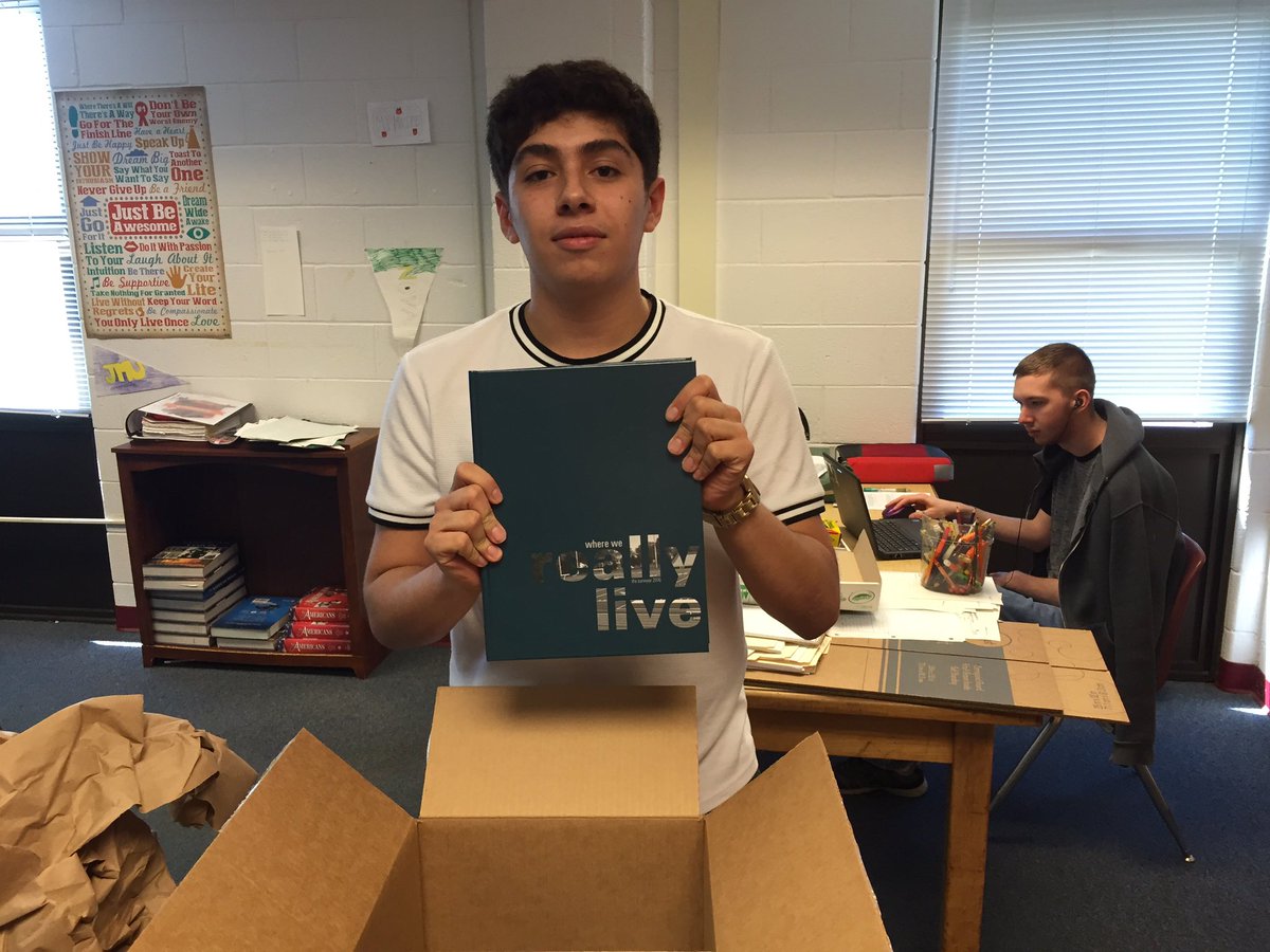 MvSurveyor's tweet photo. Editor in Chief Anderson Bonilla shows off the new Surveyor yearbook! Order yours today https://t.co/E30zaDPskq https://t.co/gCO7Tx6nPp