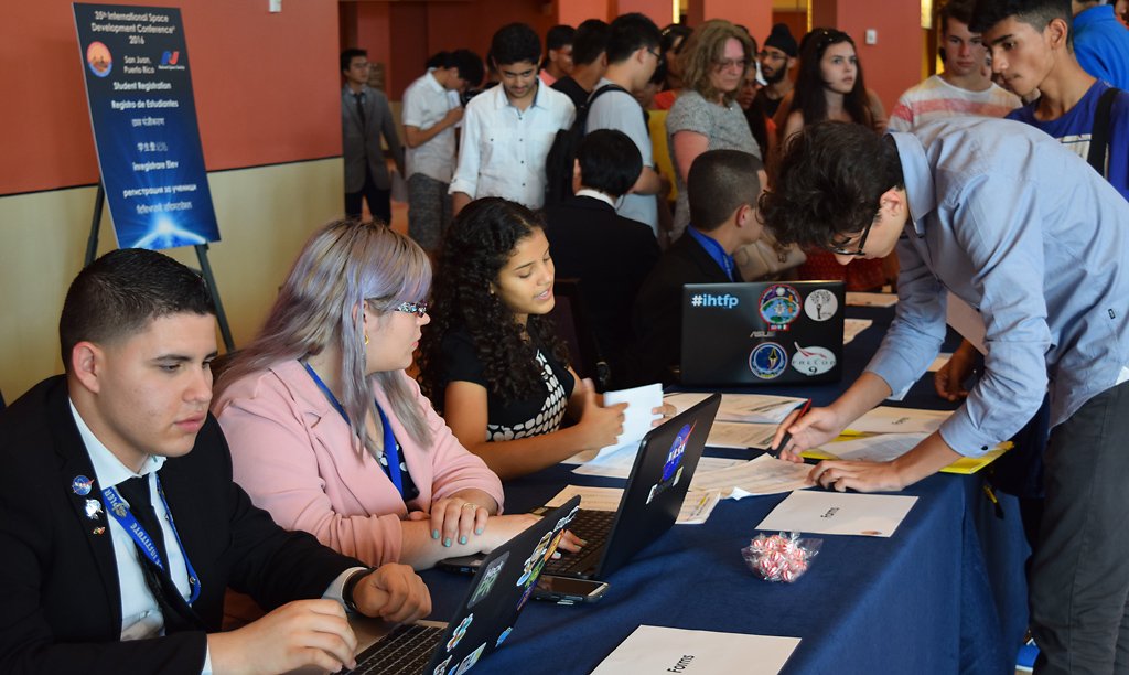 nss's tweet photo. Hardworking volunteers welcome attendees to #ISDC2016 #space #students #education #spacetweeps https://t.co/DhN3ybBTGD