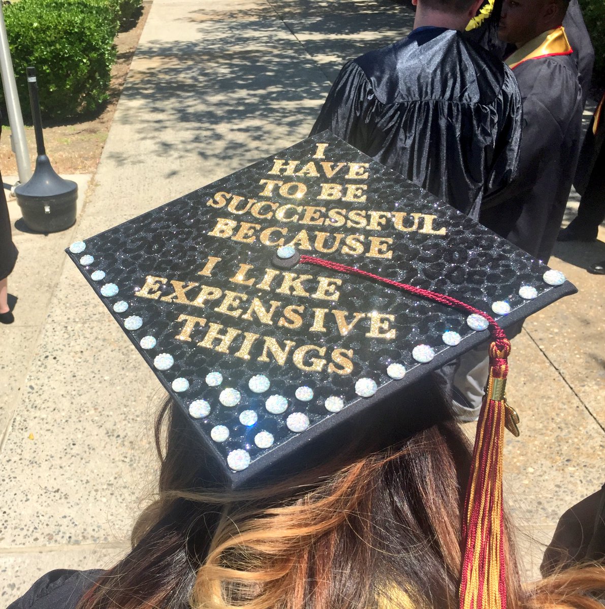 UMassGlobal1's tweet photo. Students have their caps stylized and ready to graduate! #brandmanuniversity #brandmangrad2016 https://t.co/1haPLXc7oz