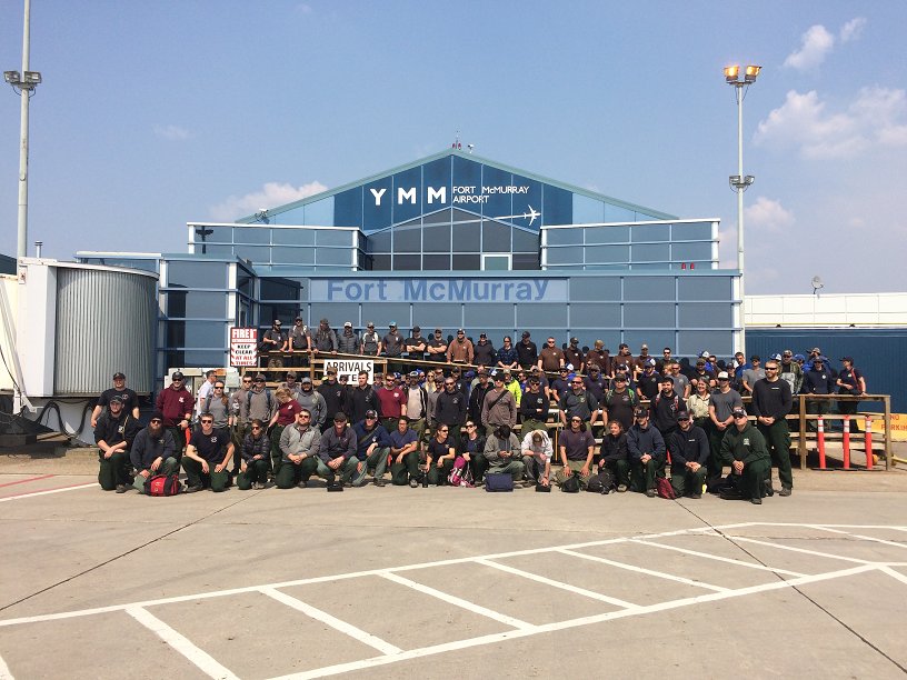The 1st flight of US firefighters has arrived @ #ymm to help battle the #ymmfire. It's inspiring to see the support!
