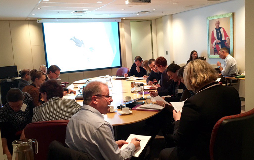 Sir Ian presides, in portrait form, over room full of grantees talking KPIs &amp; project evaluation w <a href="/SquirrelMain/">Squirrel Main</a>
