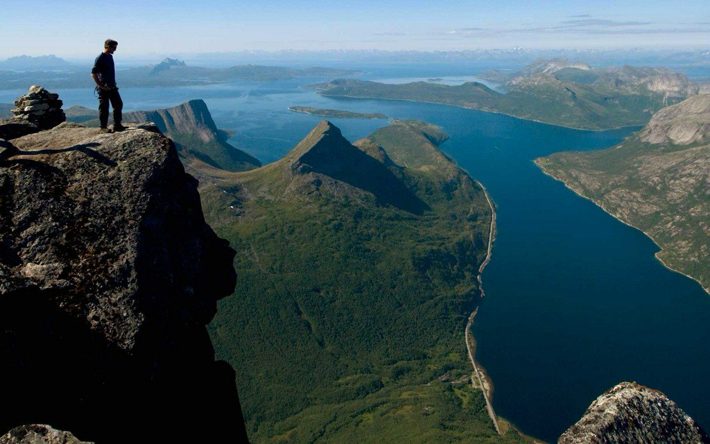 TravelLeisure's tweet photo. Watch a hiker attempt a death-defying climb down a Norwegian mountain: https://t.co/UL6FXWlgnC https://t.co/R6zeO83LrJ