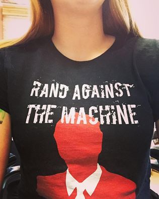 BetsyStretton's tweet photo. Between this and my #LessGovMoreFun shirt, I wonder if people gather that I am a libertarian? #RandAgainstTheMachine https://t.co/dwRxYZdWB1