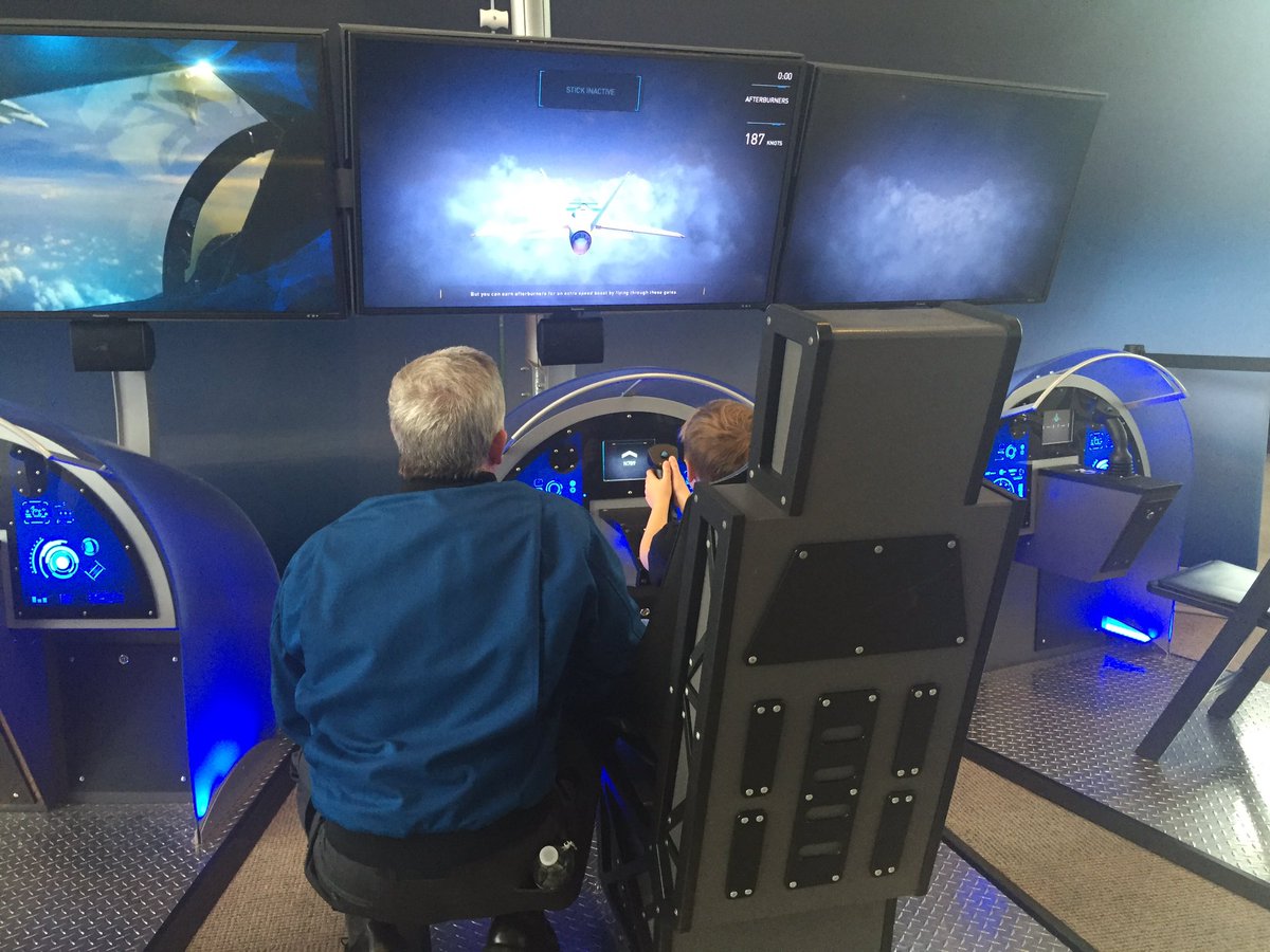 museumofflight's tweet photo. How cool is this? Boeing test pilot helps youngster check out the flight simulator in @aboveexhibition ! #Boeing100 https://t.co/6FFqnVI8dn